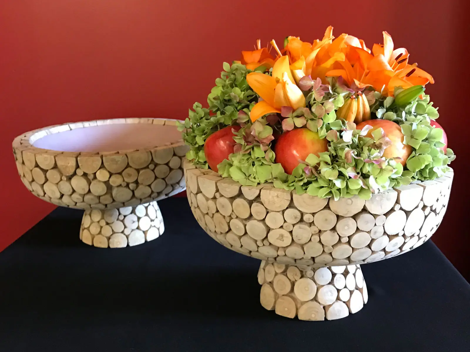 Apples, orange flowers and leaves set in a stone cradle Apples, orange flowers and leaves set in a stone cradle