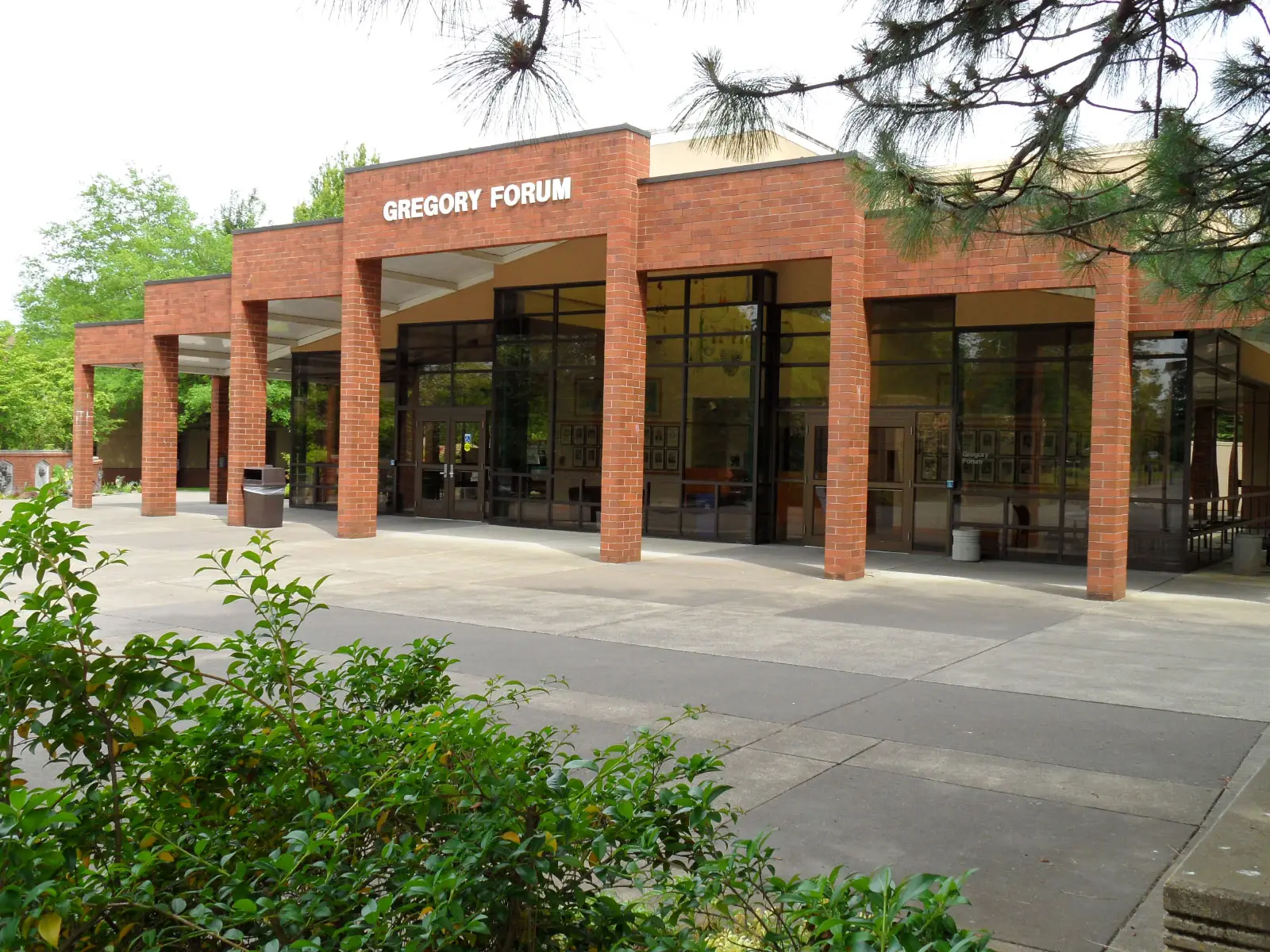 The entrance to Gregory Forum, featuring brick arches, full walls of glass and leafy surroundings at the Oregon City campus The entrance to Gregory Forum, featuring brick arches, full walls of glass and leafy surroundings at the Oregon City campus