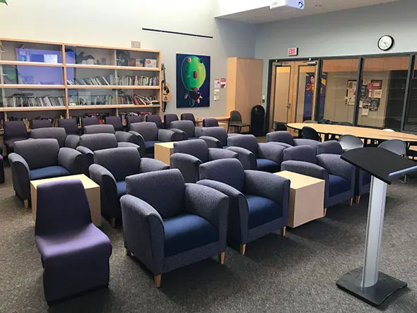 Rows of comfortable chairs in front of a podium in the Literary Arts Center in Roger Rook at the Oregon City campus Rows of comfortable chairs in front of a podium in the Literary Arts Center in Roger Rook at the Oregon City campus